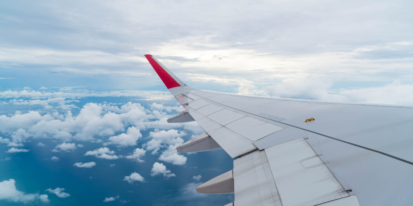 airplane flying clouds