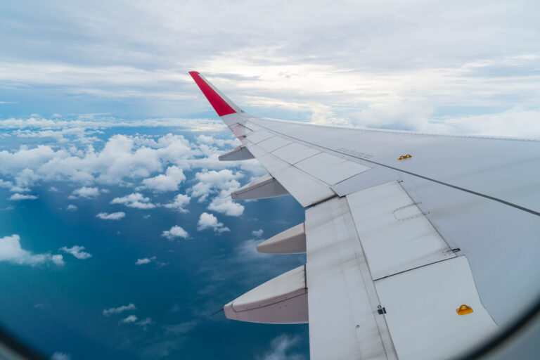 airplane flying clouds